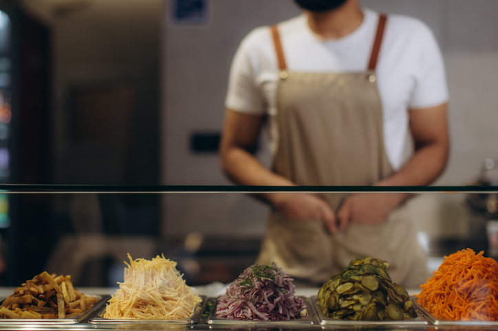 Chef preparing fresh ingredients in restaurant kitchen