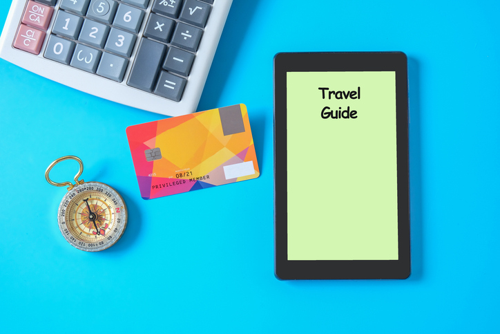 Booking for travel online by tablet and credit card.