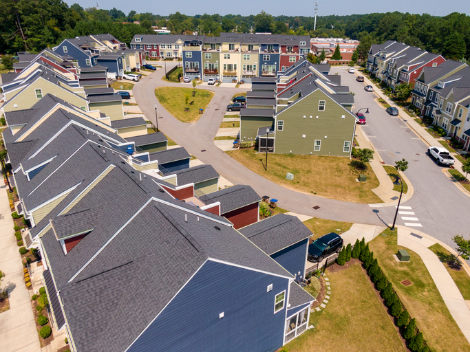 Aerial Drone View of Modern Townhome Community with Multi-Colored Siding