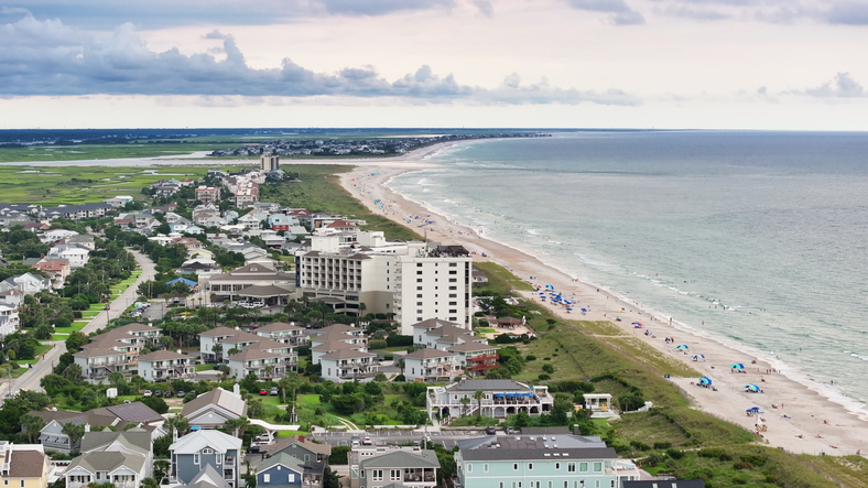 Beachfront Hotel and Condominiums Along Wrightsville Beach With Sunbathers, North Carolina