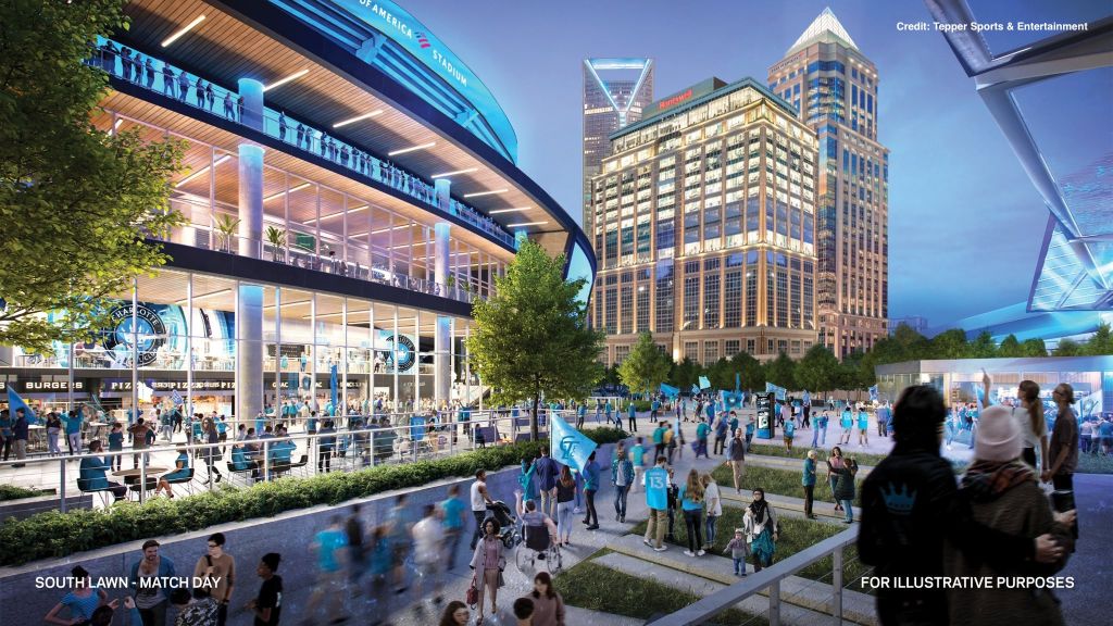 A bustling outdoor stadium and entertainment complex with shops, restaurants, and crowds of people enjoying the lively atmosphere.