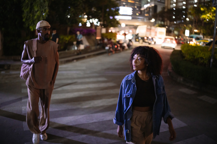 Young couple in a night city walk