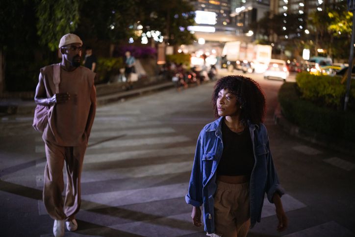 Young couple in a night city walk