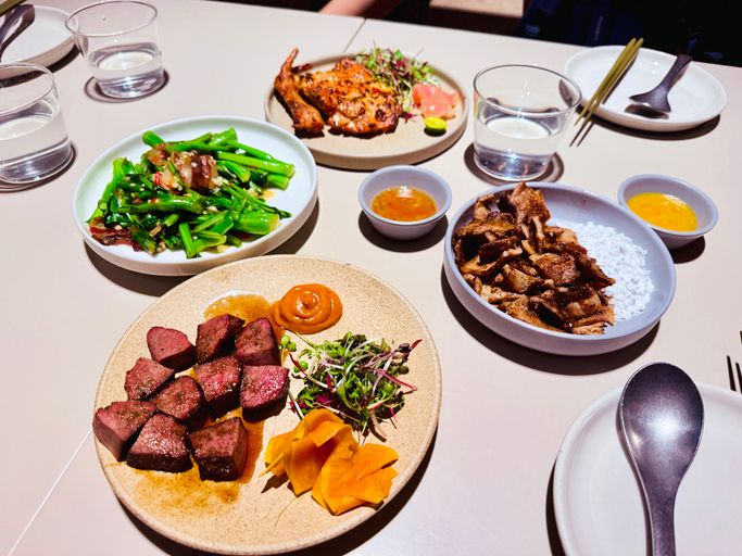 Restaurant Table Set With a Shared Chinese Meal